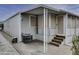 Side view of the house showing the entrance and AC unit at 17200 W Bell Rd # 1731, Surprise, AZ 85374