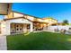 Large backyard with covered patio and lawn at 19641 E Emperor Blvd, Queen Creek, AZ 85142