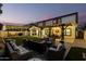 Spacious backyard with pergola, fire pit, and seating area at 19641 E Emperor Blvd, Queen Creek, AZ 85142