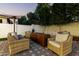 Relaxing backyard patio with fire pit and seating at 19641 E Emperor Blvd, Queen Creek, AZ 85142