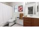 Clean bathroom with wooden vanity and white toilet at 19641 E Emperor Blvd, Queen Creek, AZ 85142