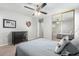 Bedroom with mirrored closet doors and ceiling fan at 19641 E Emperor Blvd, Queen Creek, AZ 85142