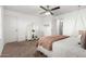 Bright bedroom with carpeted floor, vanity, and ceiling fan at 19641 E Emperor Blvd, Queen Creek, AZ 85142