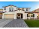 Two-story house with a two-car garage and landscaping at 19641 E Emperor Blvd, Queen Creek, AZ 85142