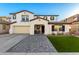Two-story home with a landscaped yard and a paved driveway at 19641 E Emperor Blvd, Queen Creek, AZ 85142