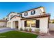 Two-story home with a neutral color scheme and a front yard at 19641 E Emperor Blvd, Queen Creek, AZ 85142