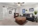 Comfortable Gathering room featuring leather seating and a ceiling fan at 19641 E Emperor Blvd, Queen Creek, AZ 85142