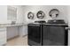 Laundry room with washer, dryer, and countertop workspace at 19641 E Emperor Blvd, Queen Creek, AZ 85142