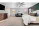 Bright main bedroom featuring a dresser, couch and ceiling fan at 19641 E Emperor Blvd, Queen Creek, AZ 85142