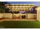 Evening view of covered patio with seating at 19641 E Emperor Blvd, Queen Creek, AZ 85142