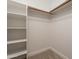 Spacious closet with shelving and hanging rods at 20449 N 105Th Ave, Peoria, AZ 85382