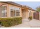 House exterior with a security door and manicured hedges at 20449 N 105Th Ave, Peoria, AZ 85382