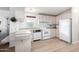 Kitchen with white appliances and light wood cabinets at 205 S Higley Rd # 32, Mesa, AZ 85206