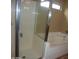 Bathroom with shower, bathtub, and tiled flooring at 2114 N 94Th Ave, Phoenix, AZ 85037