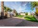Landscaped backyard with patio and built-in grill at 2146 E Whitton Ave, Phoenix, AZ 85016