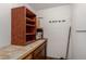Unfinished basement with shelving and workbench at 2146 E Whitton Ave, Phoenix, AZ 85016