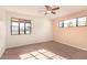 Bright bedroom with two windows and ceiling fan at 2146 E Whitton Ave, Phoenix, AZ 85016
