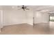 Spacious living area with tile floors and multiple ceiling fans at 2146 E Whitton Ave, Phoenix, AZ 85016
