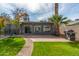 Back patio with access to grassy area at 2146 E Whitton Ave, Phoenix, AZ 85016