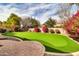 Putting green and nicely landscaped backyard at 3016 E Maplewood St, Gilbert, AZ 85297