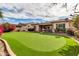 Artificial turf putting green in the backyard at 3016 E Maplewood St, Gilbert, AZ 85297