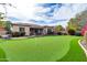 Home's backyard features a putting green at 3016 E Maplewood St, Gilbert, AZ 85297
