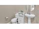 Simple bathroom with pedestal sink and toilet at 3016 E Maplewood St, Gilbert, AZ 85297