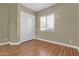 Simple bedroom with wood flooring and closet at 3016 E Maplewood St, Gilbert, AZ 85297