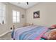 Bright bedroom with large window and wood flooring at 3016 E Maplewood St, Gilbert, AZ 85297