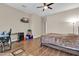 Bright bedroom with wood floors, a desk, and window seating at 3016 E Maplewood St, Gilbert, AZ 85297
