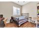 Bedroom with wood flooring, window and a workspace at 3016 E Maplewood St, Gilbert, AZ 85297