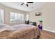 Spacious bedroom with wood flooring and large windows at 3016 E Maplewood St, Gilbert, AZ 85297