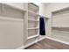 Large walk-in closet with shelving and hanging rods at 3016 E Maplewood St, Gilbert, AZ 85297