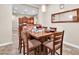 Bright dining room with a wood table and kitchen access at 3016 E Maplewood St, Gilbert, AZ 85297