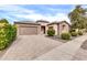 Single-story home with a large driveway and landscaping at 3016 E Maplewood St, Gilbert, AZ 85297