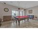 Game room features a pool table, treadmill, and comfortable seating at 3016 E Maplewood St, Gilbert, AZ 85297