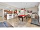 Game room with pool table, kitchen views, and treadmill at 3016 E Maplewood St, Gilbert, AZ 85297