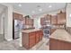 Kitchen features island, stainless steel appliances, and ample counter space at 3016 E Maplewood St, Gilbert, AZ 85297