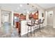 Kitchen boasts an island, stainless steel appliances, and bar seating at 3016 E Maplewood St, Gilbert, AZ 85297