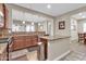 Open kitchen features granite island and breakfast bar at 3016 E Maplewood St, Gilbert, AZ 85297