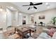 Living room with hardwood floors, ceiling fan, and comfortable seating at 3016 E Maplewood St, Gilbert, AZ 85297