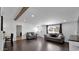 Living room with hardwood floors and exposed beam at 306 N Hawes Rd, Mesa, AZ 85207