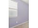 Bedroom with a window and light purple walls at 31011 W Indianola Ave, Buckeye, AZ 85396