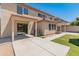 Rear view of house showcasing patio and yard at 3127 W Maya Way, Phoenix, AZ 85083