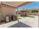 Covered patio with AC units and access to backyard at 3127 W Maya Way, Phoenix, AZ 85083