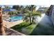 Resort-style pool with misting system and palm trees at 4855 S Astral Hts, Mesa, AZ 85212