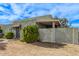 Side view of a light green stucco house with landscaping at 5301 W Hearn Rd, Glendale, AZ 85306