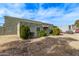 Exterior view of a light green stucco house with landscaping at 5301 W Hearn Rd, Glendale, AZ 85306