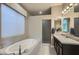 Luxurious bathroom with soaking tub and double vanity at 6029 E Santa Cruz Dr, Scottsdale, AZ 85266