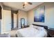 Well-lit bedroom featuring a queen-size bed and private access at 6029 E Santa Cruz Dr, Scottsdale, AZ 85266